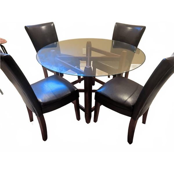 Round Glass Top Dining Table with Four Faux Leather Upholstered Chairs