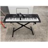 Image 1 : Alesis Harmony 61 Portable 61-Key Keyboard w/ Stand, Microphone & Power Adapter