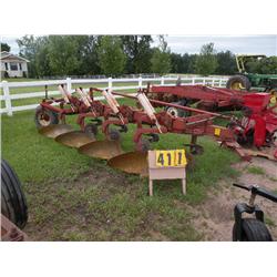 Int'l 710 four bottum plow with spring recet