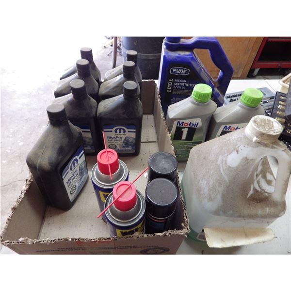 box of various shop fluids and oil