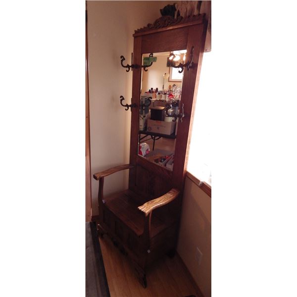 antique oak hallway stand with bevelled mirror and ornate coat hooks