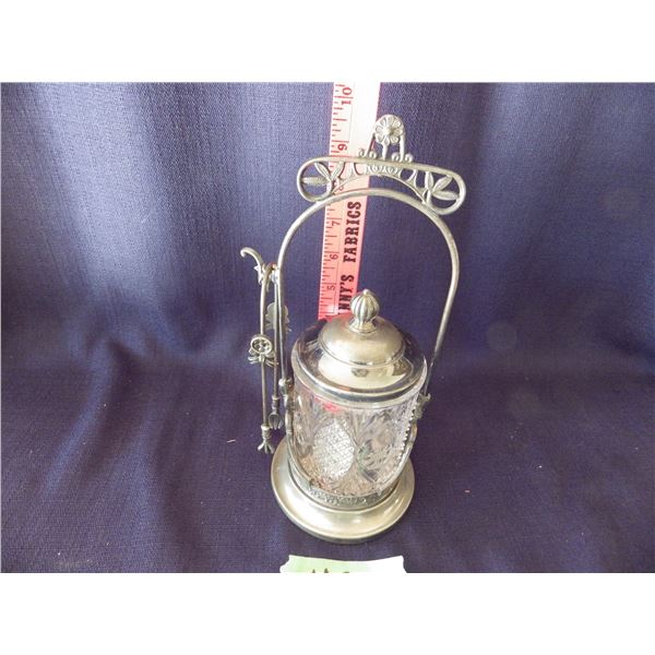 Antique Victorian Era Pickle castor featuring a clear cut or pressed glass jar with a matching lid, 