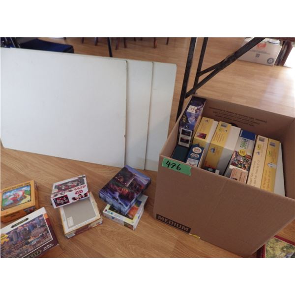 box of puzzles - The white board in the background was used to put the puzzles on