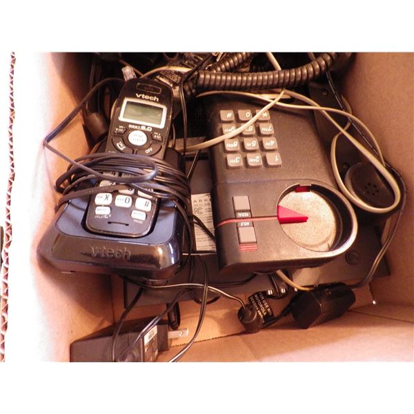 box with telephones and electronics