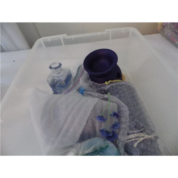 plastic container with decorative candles etc