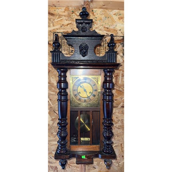 Carved Wood Wall Clock with Brass Face and Ornate Pediment
