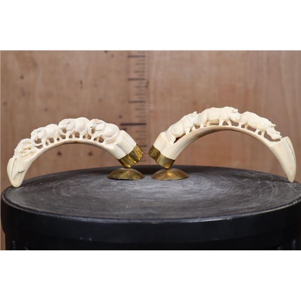 Matching Set of (2) WARTHOG Tusks Featuring Elephants and Rhinos with Brass Stands