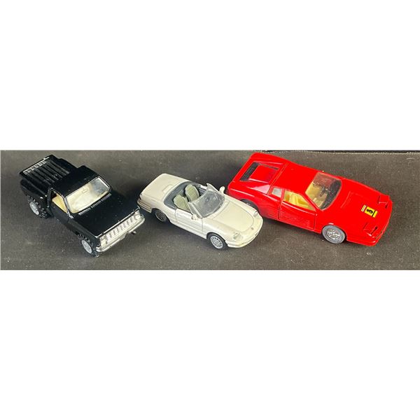 3 Die-Cast Cars: Testarossa, Alfa Romeo Spider 1989 1/43, Chevy Silverado