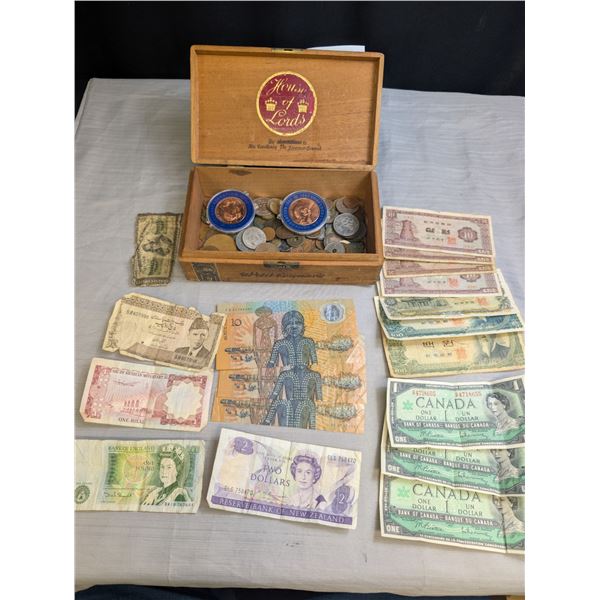An Old Wooden Cigar Box Full of World Coins and Paper Money
