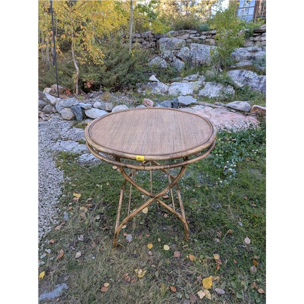 Bamboo/Rattan table. Full size, about waist high, with 31 inch diameter top. Good Condition. Top com