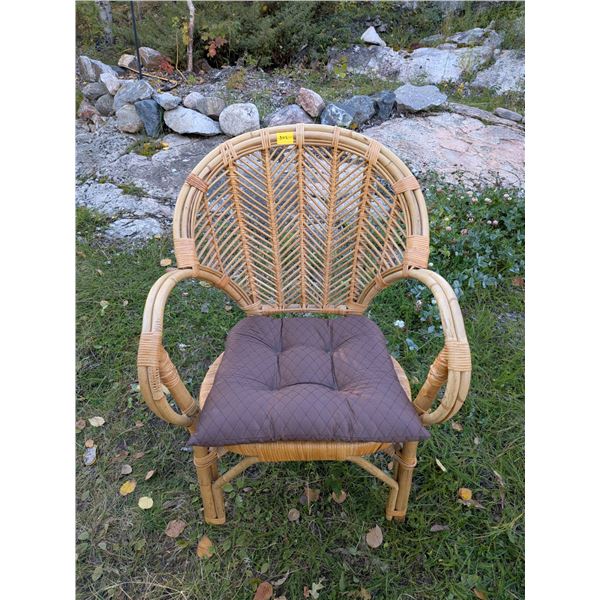 Very solid and comfortable vintage rattan/ bamboo fan-back armchair with detachable seat cushion.