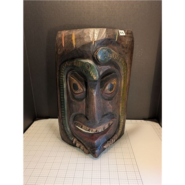 Hand-carved wooden tribal mask with snake detail. About 18-19 inches tall.