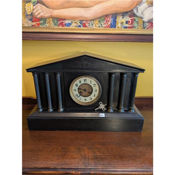 Genuine 19th-century Victorian black slate mantel clock. Circular dial, original hands and key. Insc