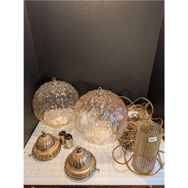 Pair of mid century modern swag pendant lights. Includes metal caps, one internal metal cylinder dif
