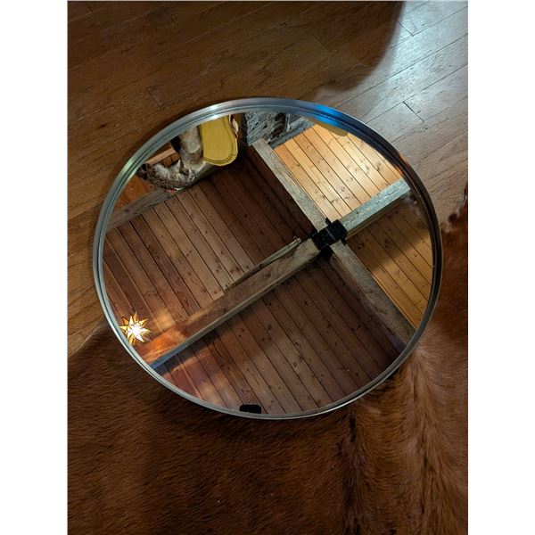 Large circular 27-inch diameter silver, salon mirror in good condition. Easy to hang.
