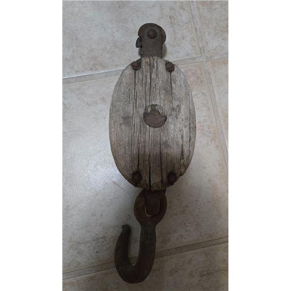 Antique wooden block & tackle pulley. 16" in length, 5" in width.  No visible maker's mark.