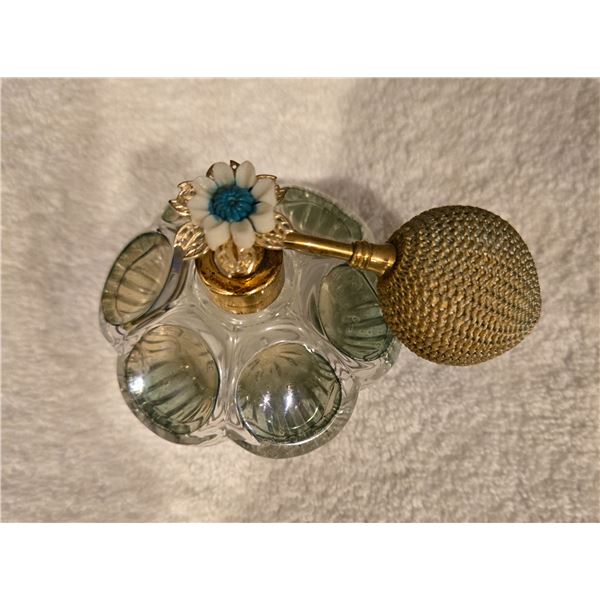 Vintage clear and greenish-tinted pressed glass perfume atomizer bottle.  Gold tone spray pump with 