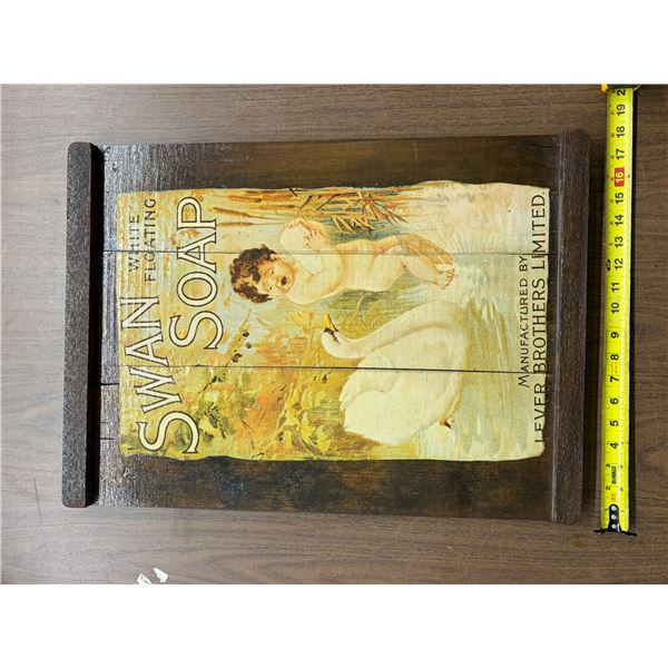 Vintage Swan White Floating Soap advertisement mounted on a rustic wooden tray.