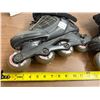 Image 2 : Pair of black and gray Rollerblade Pro 05 inline fitness skates.