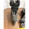 Image 3 : Pair of black and gray Rollerblade Pro 05 inline fitness skates.