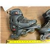 Image 4 : Pair of black and gray Rollerblade Pro 05 inline fitness skates.