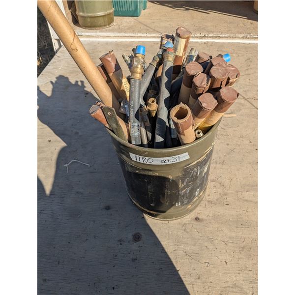 Barrel of assorted hydraulic hoses