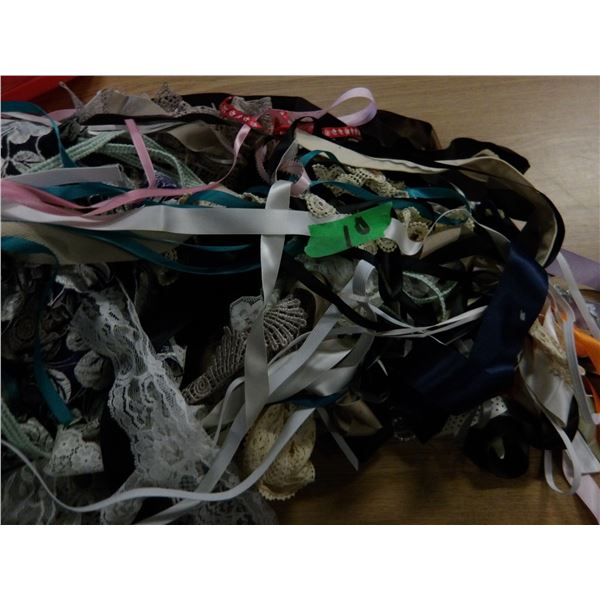 UNCLAIMED STORAGE:  1 CU FT RUBBERMAID TOTE & LID C/W ASSORTED SEWING MATERIAL