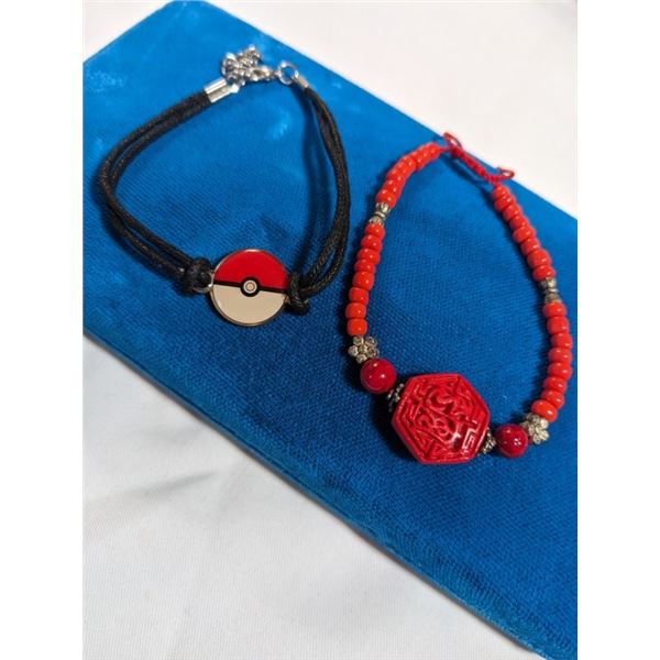 2 BRACELETS, POKEMON AND RED CINNEBAR