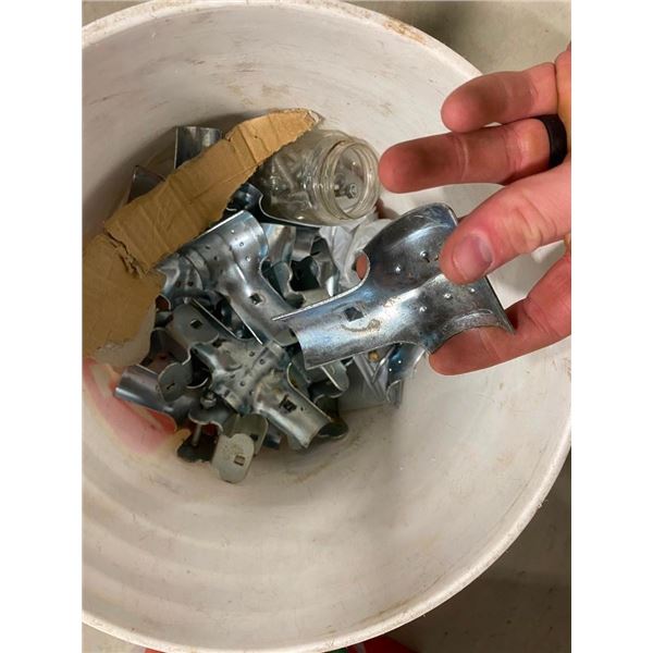 1/2 PAIL OF SOME SORT OF BRACKETS FOR PIPING