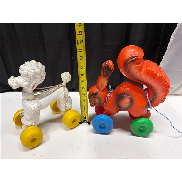 Vintage blow-mold plastic pull toys from the 1950s or 1960s, commonly made in Canada.