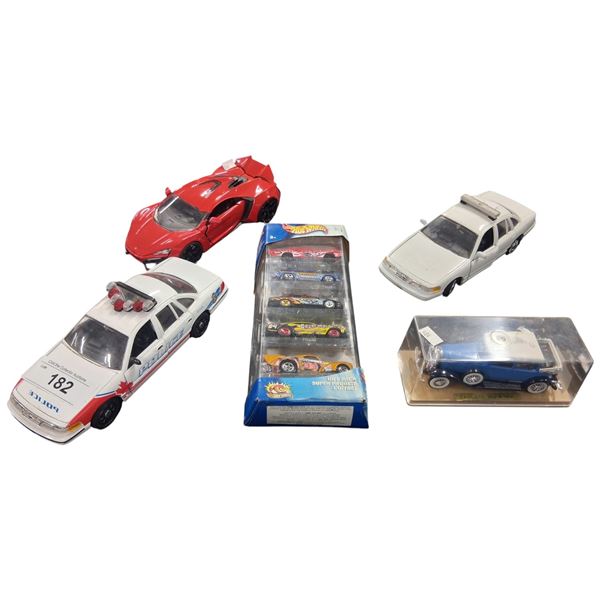 4 die cast vehicles and Hotwheels pack