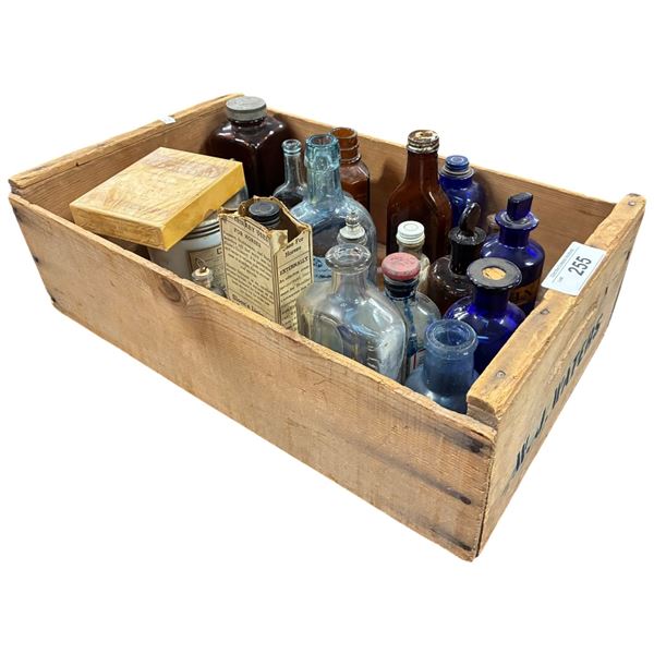 Wooden crate filled with misc glass apothacary bottles