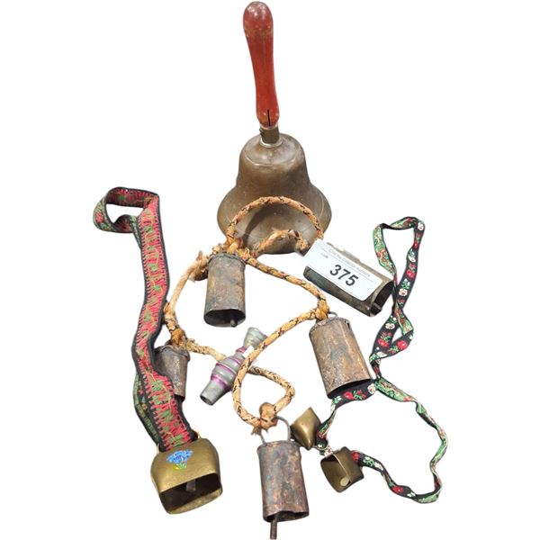 Collection of vintage brass bells and duck call