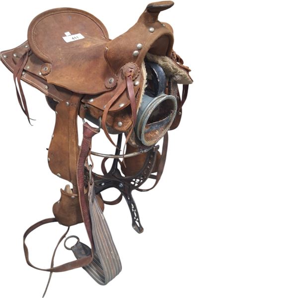 Vintage western children's saddle on stand