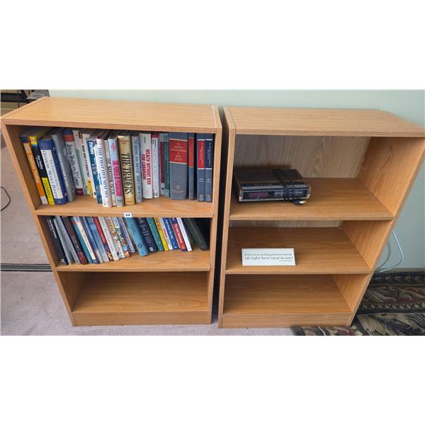 Wood Bookcases With Assorted Business and Self-Help Books and GE Alarm Clock