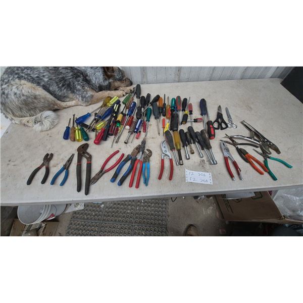 Assortment of Hand Tools Including Screwdrivers, Pliers, Nut Drivers, Scissors, Shears