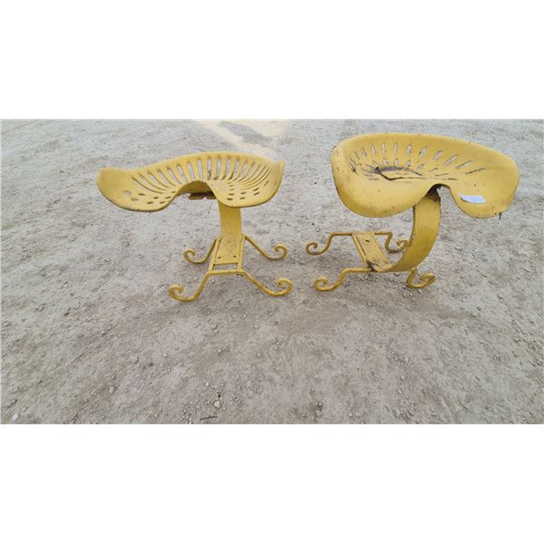Pair of Repurposed Antique Cast-Iron Tractor Seat Stools with Yellow Finish and Scrolled Bases