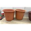 Image 5 : Assorted Plastic Planter Pots in Various Colors and Sizes with Green Ceramic Pot