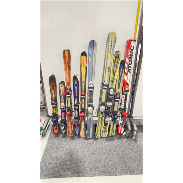 LOT OF 10 **USED** ASSORTED ALPINE SKIS WITH BINDINGS