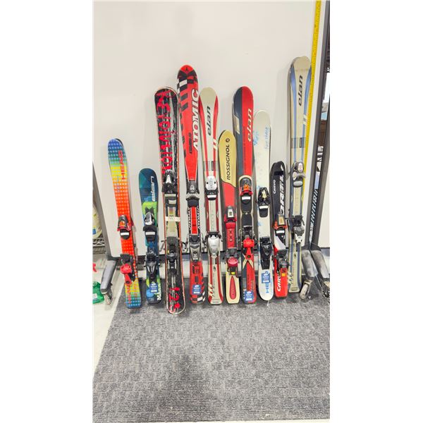 LOT OF 10 **USED** ASSORTED ALPINE SKIS WITH BINDINGS