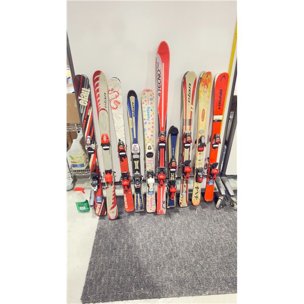 LOT OF 10 **USED** ASSORTED ALPINE SKIS WITH BINDINGS