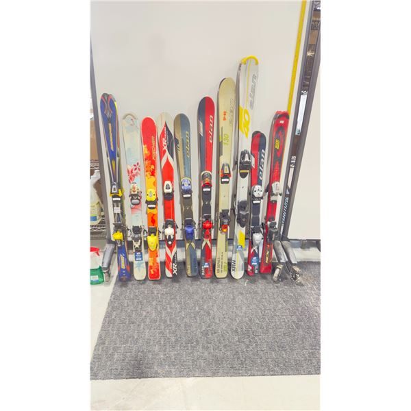LOT OF 10 **USED** ASSORTED ALPINE SKIS WITH BINDINGS