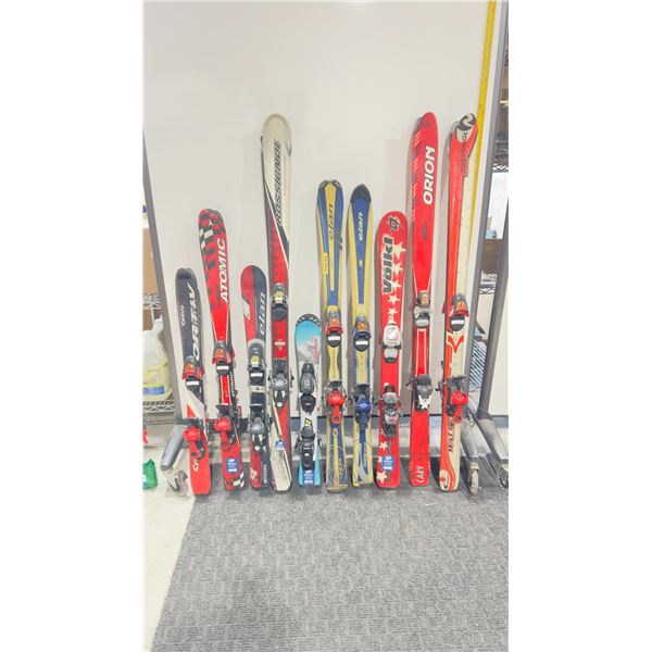 LOT OF 10 **USED** ASSORTED ALPINE SKIS WITH BINDINGS