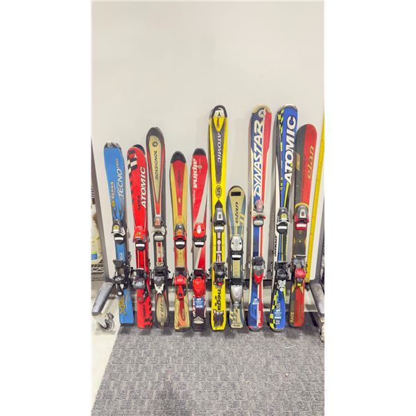 LOT OF 10 **USED** ASSORTED ALPINE SKIS WITH BINDINGS