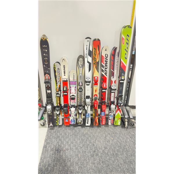 LOT OF 10 **USED** ASSORTED ALPINE SKIS WITH BINDINGS