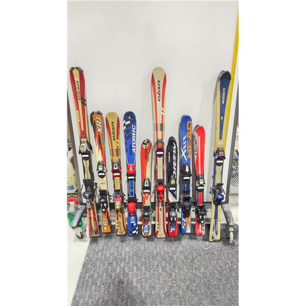 LOT OF 10 **USED** ASSORTED ALPINE SKIS WITH BINDINGS