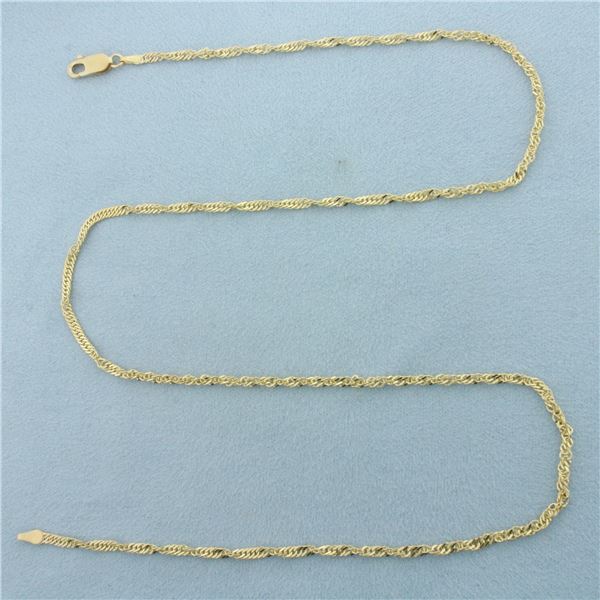 20 Inch Twisting Curb Link Chain Necklace in 14k Yellow Gold