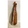 Image 1 : GOURD VESSEL DECORATED WITH FUR AND SHELLS.