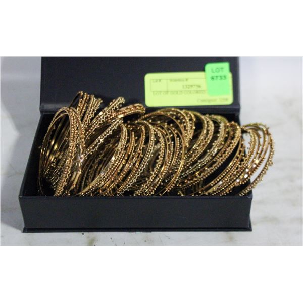 LOT OF GOLD COLORED BANGLES