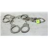 Image 1 : 4 PAIRS OF HANDCUFFS - OPEN BUTTON ON CUFFS